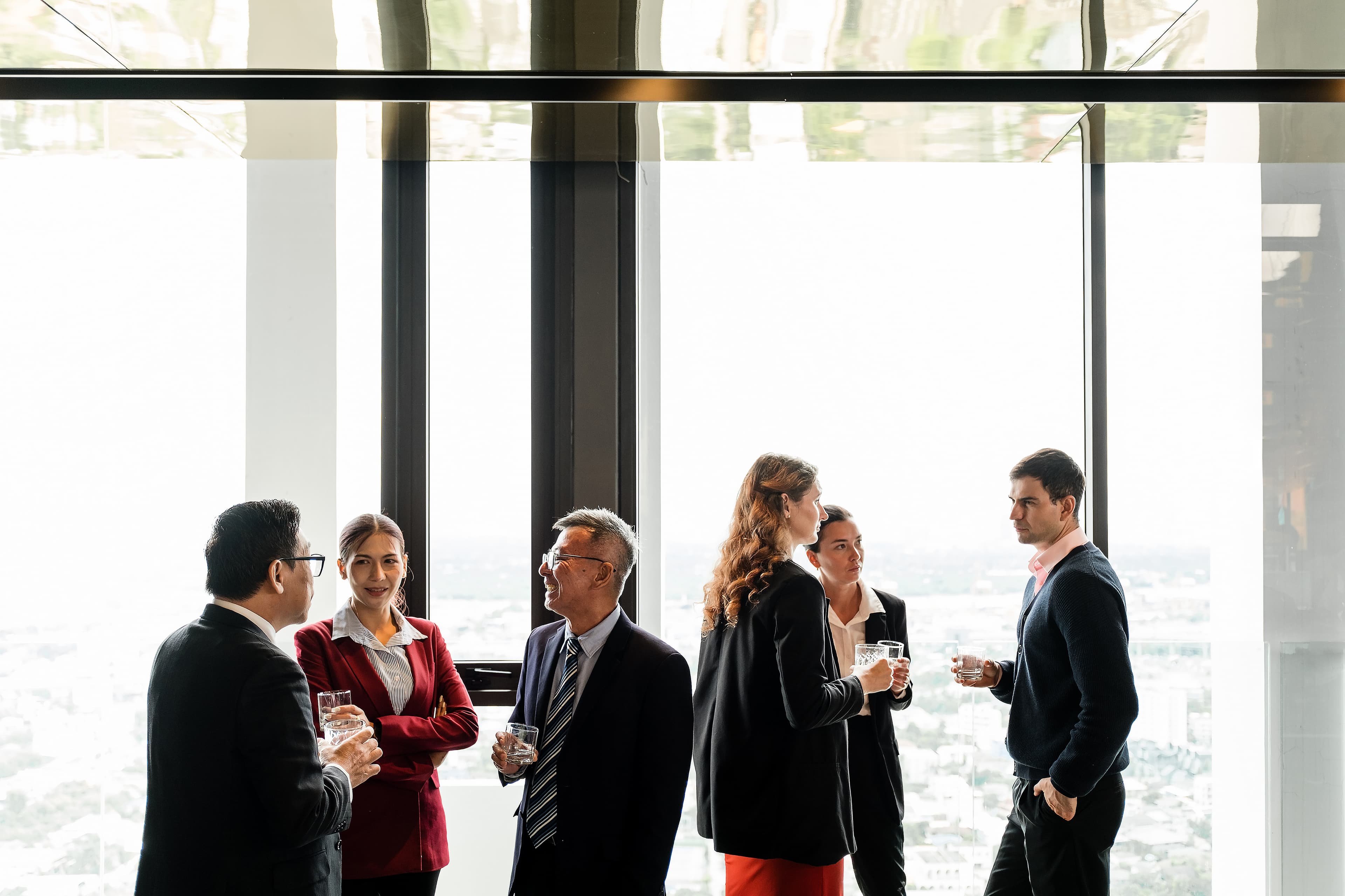 professionals networking with drinks AdobeStock 1693924663