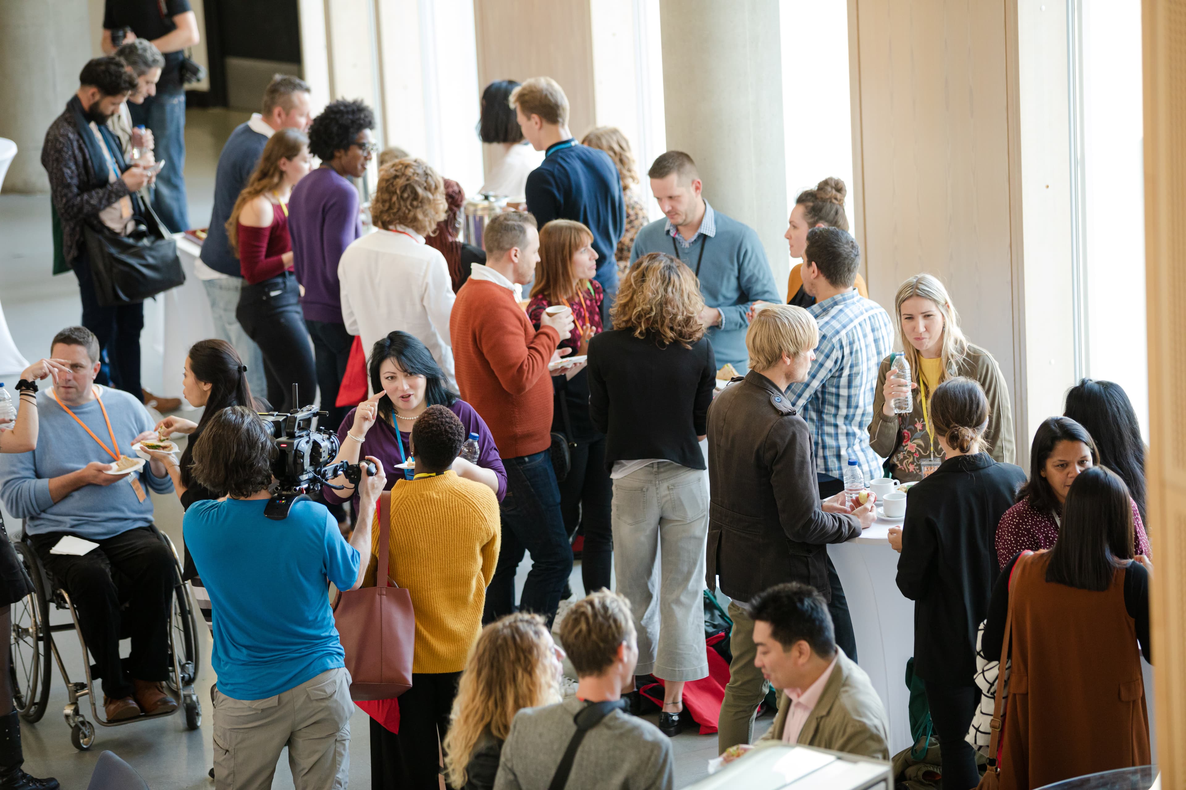 diverse crowd of people networking at a conference