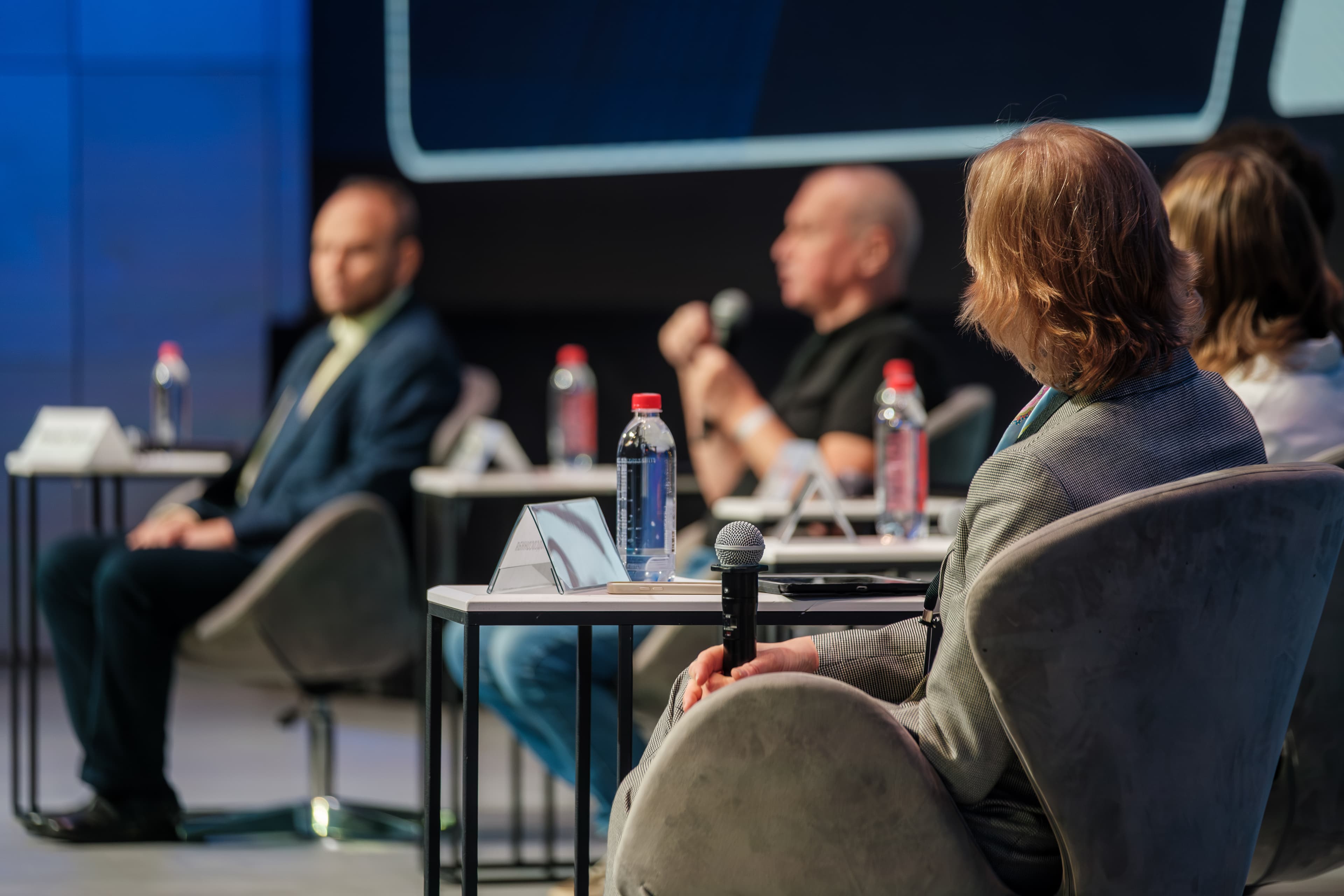Panel discussion on stage AdobeStock 1833330662