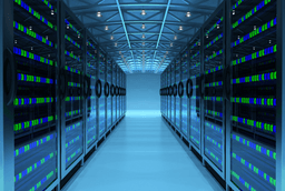 Rows of illuminated server racks in a data centre corridor