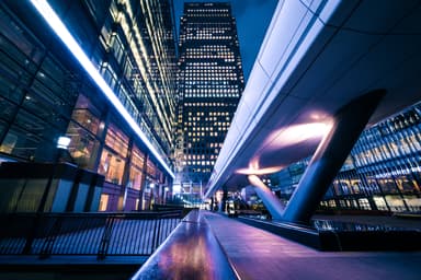 Canary Wharf financial district at night, illustrating the UK economy and tech sector context of the Autumn Budget 2026