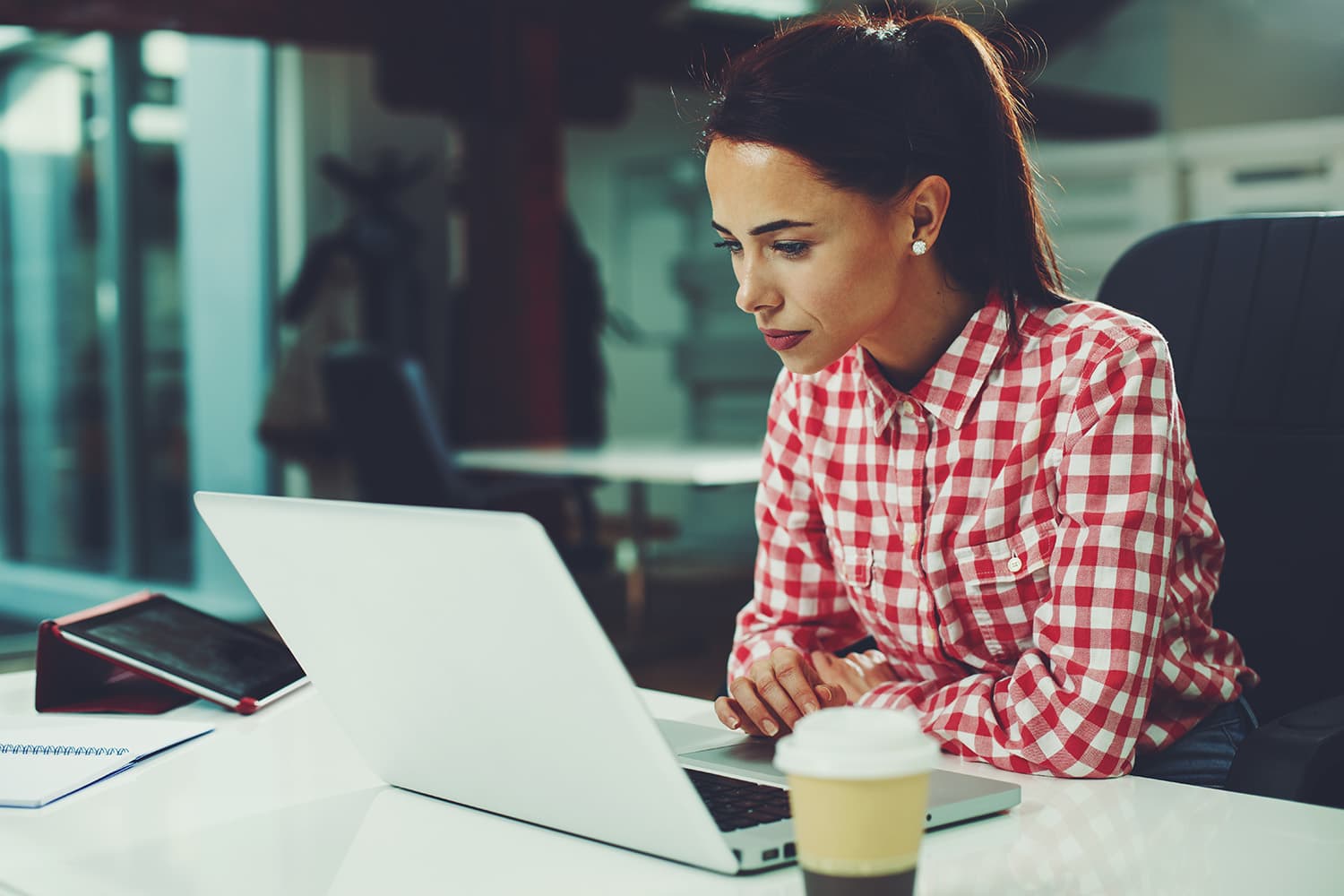 Woman looking at laptop
