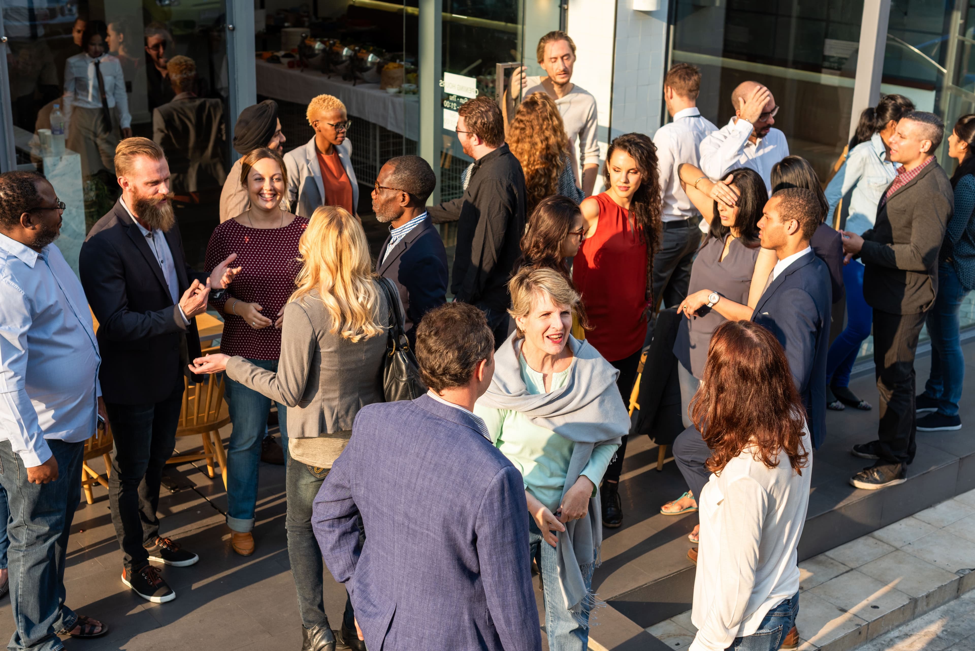 professionals networking outdoors AdobeStock 1986624347