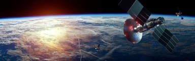 Satellites orbiting Earth with solar panels deployed against a backdrop of the planet's curved horizon
