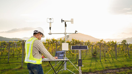 Man with tech in field  CLIMATE CAMPAIGN ONLY.jpg
