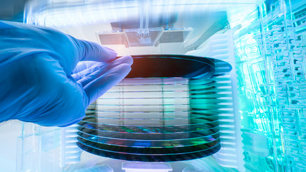 Gloved Hand Holding a Silicon Wafer iStock-1956523068.jpg 1