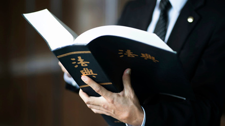 lawyer_holding_chinese_code_of_law.jpg