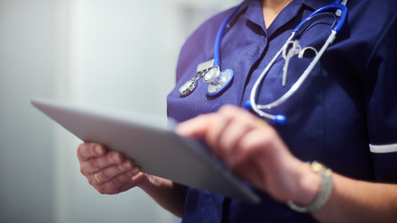 H&SC - Doctor or surgeon using digital tablet iStock-1130586553.jpg